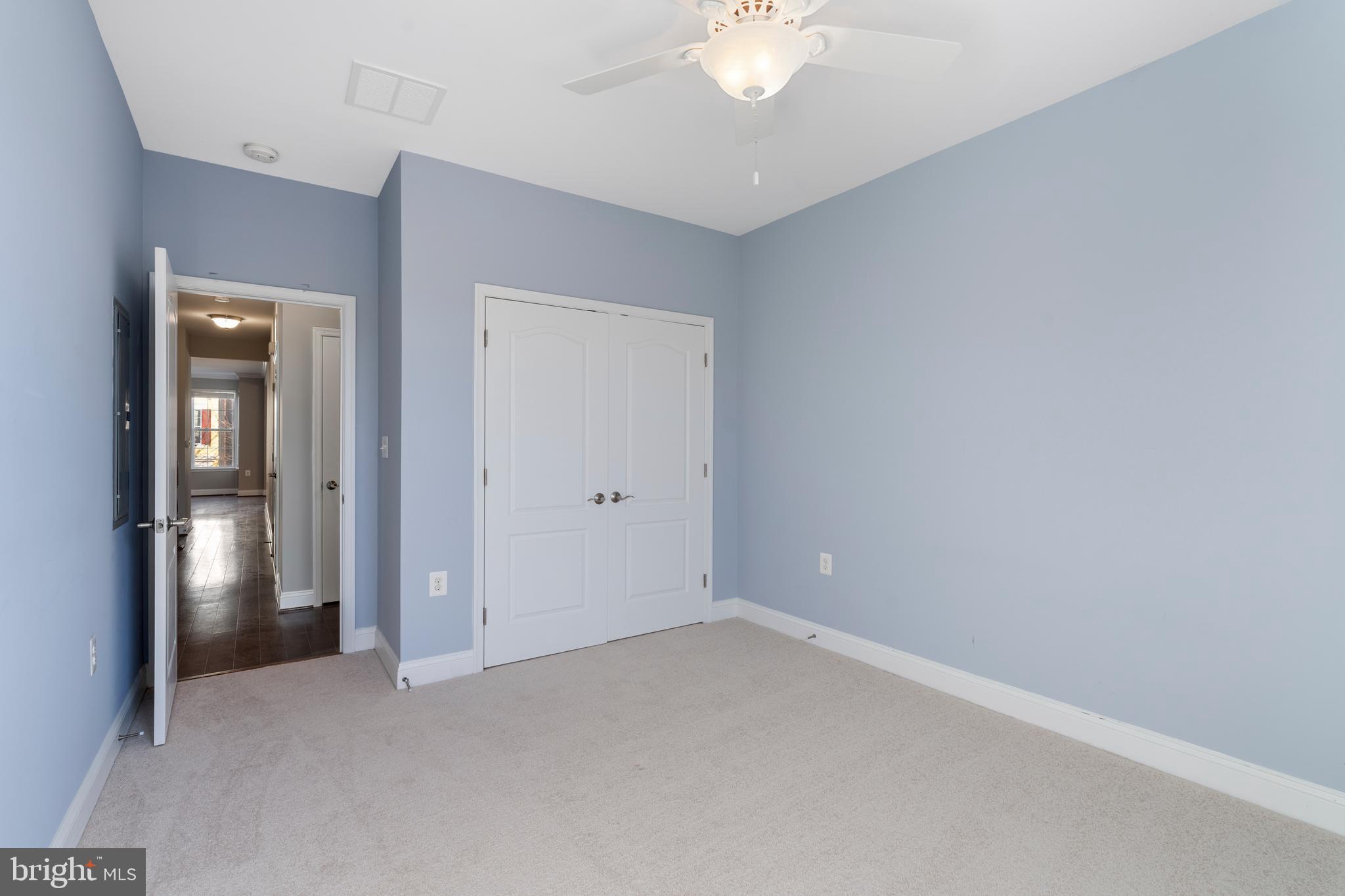 11246 Chase Street, Unit 141 Fulton, MD 20759 - Photo 31 of 37 an empty room with fan