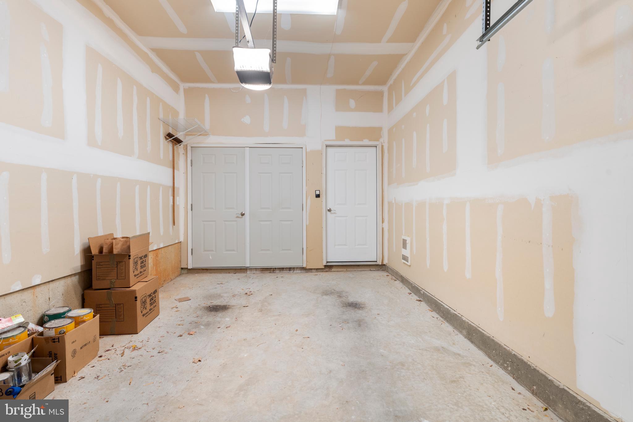 11246 Chase Street, Unit 141 Fulton, MD 20759 - Photo 34 of 37 an empty room with wooden floor and windows