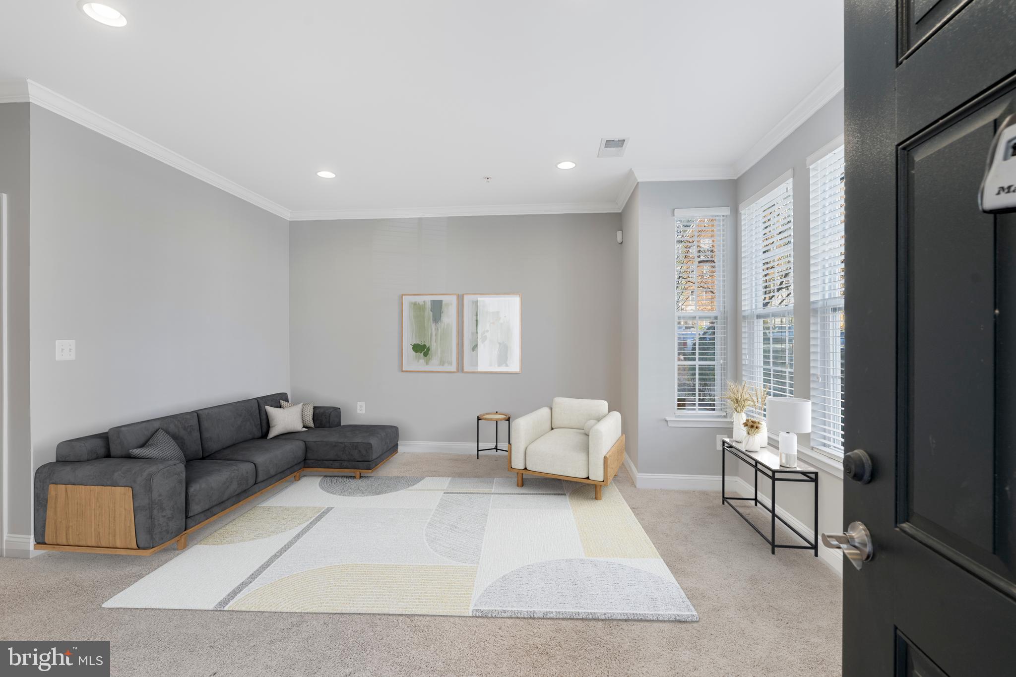 11246 Chase Street, Unit 141 Fulton, MD 20759 - Photo 5 of 37 a living room with furniture and large windows