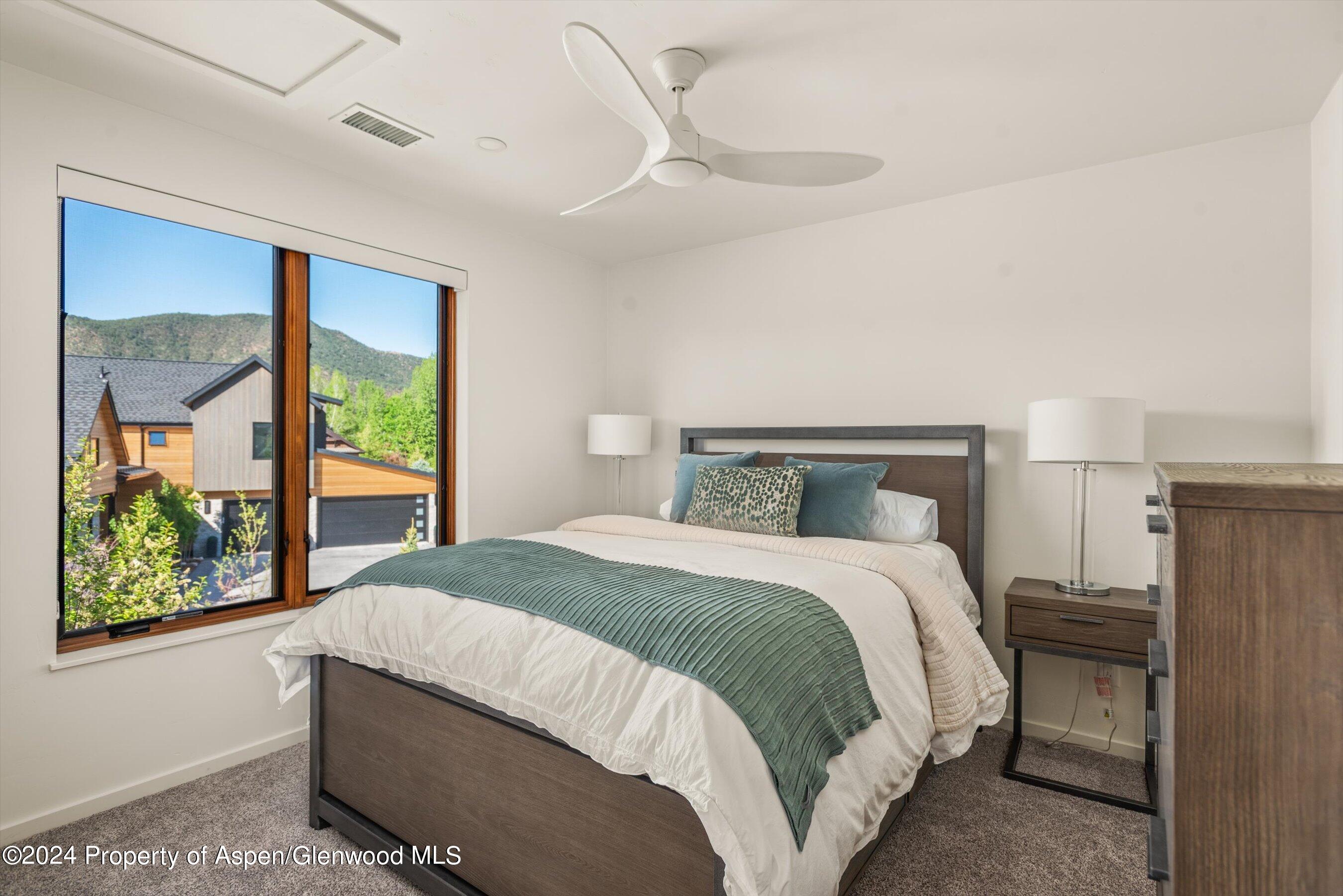 16 Puma Carbondale, CO 81623 - Photo 16 of 21 a bedroom with a large bed and a window