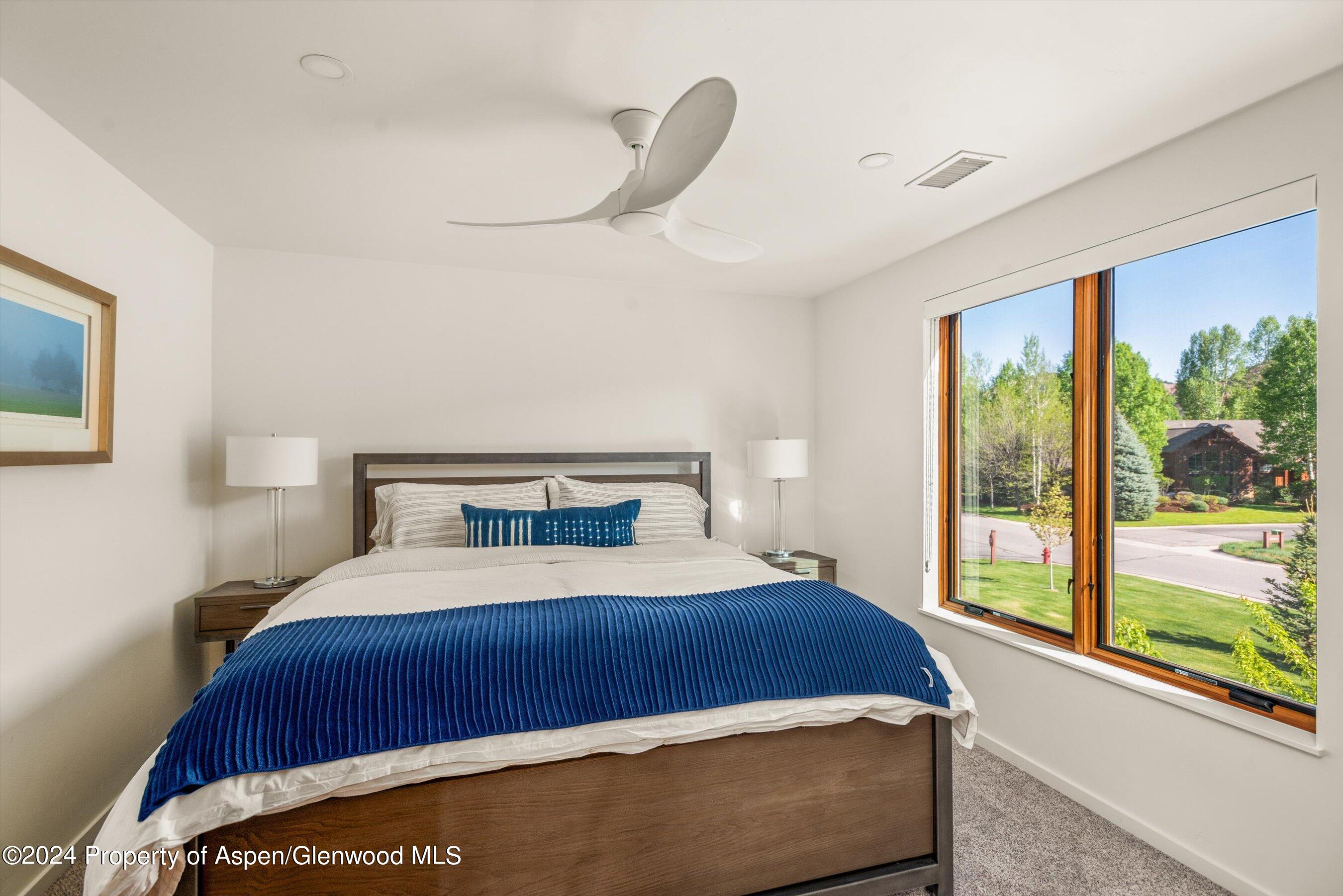 16 Puma Carbondale, CO 81623 - Photo 18 of 21 a bedroom with a large bed and a large window