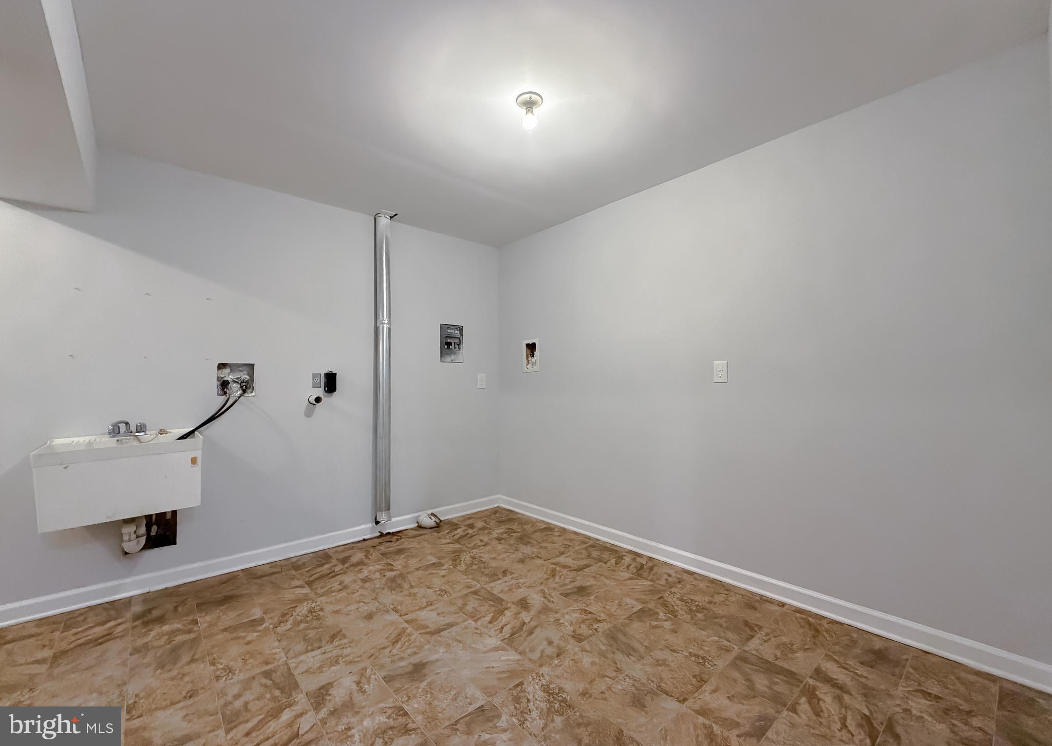 12468 Ridge Road Lusby, MD 20657 - Photo 53 of 65 Laundry room and storage