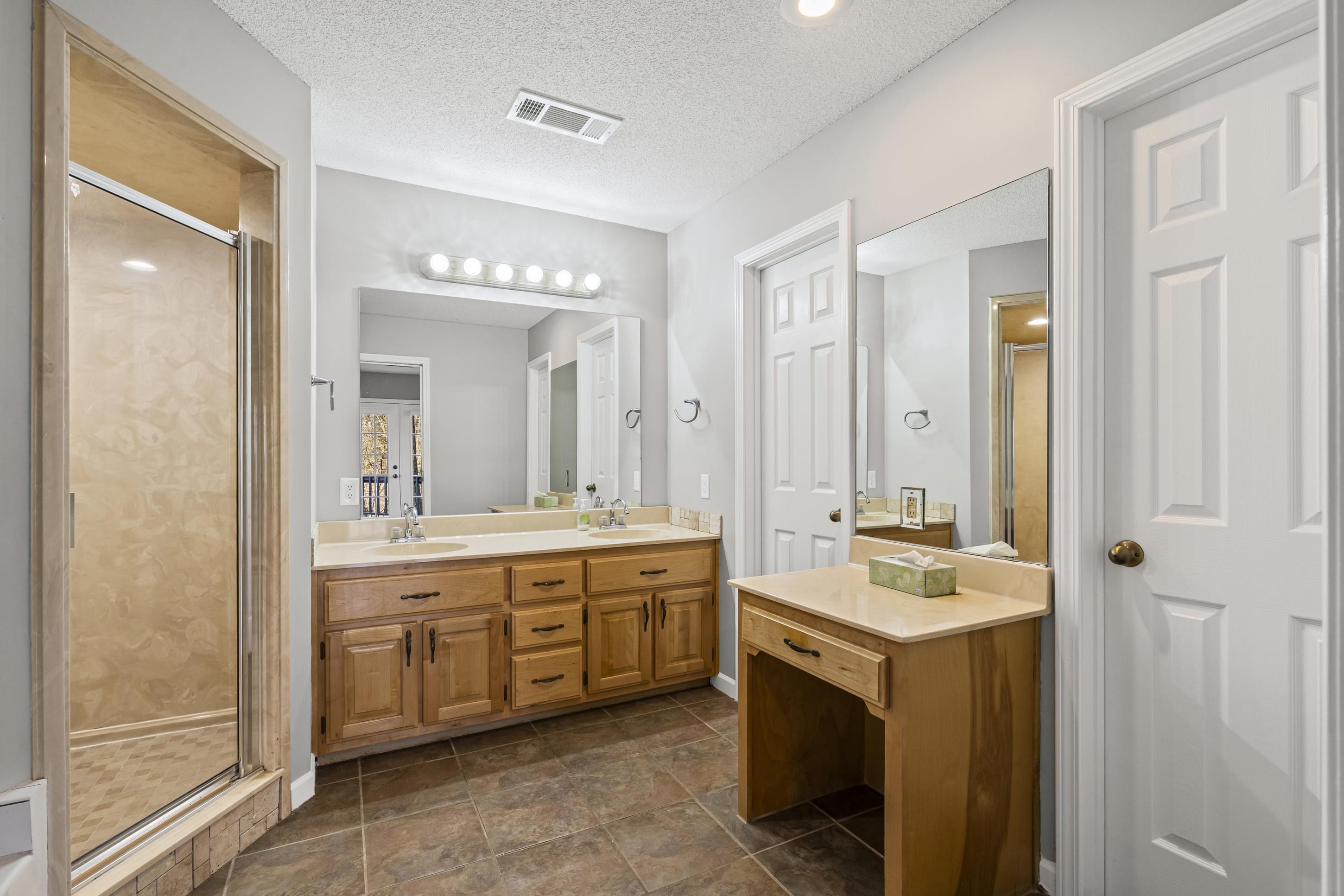 225 Poplar Grove Church Road Drummonds, TN 38023 - Photo 14 of 30 a spacious bathroom with a double vanity sink mirror and double