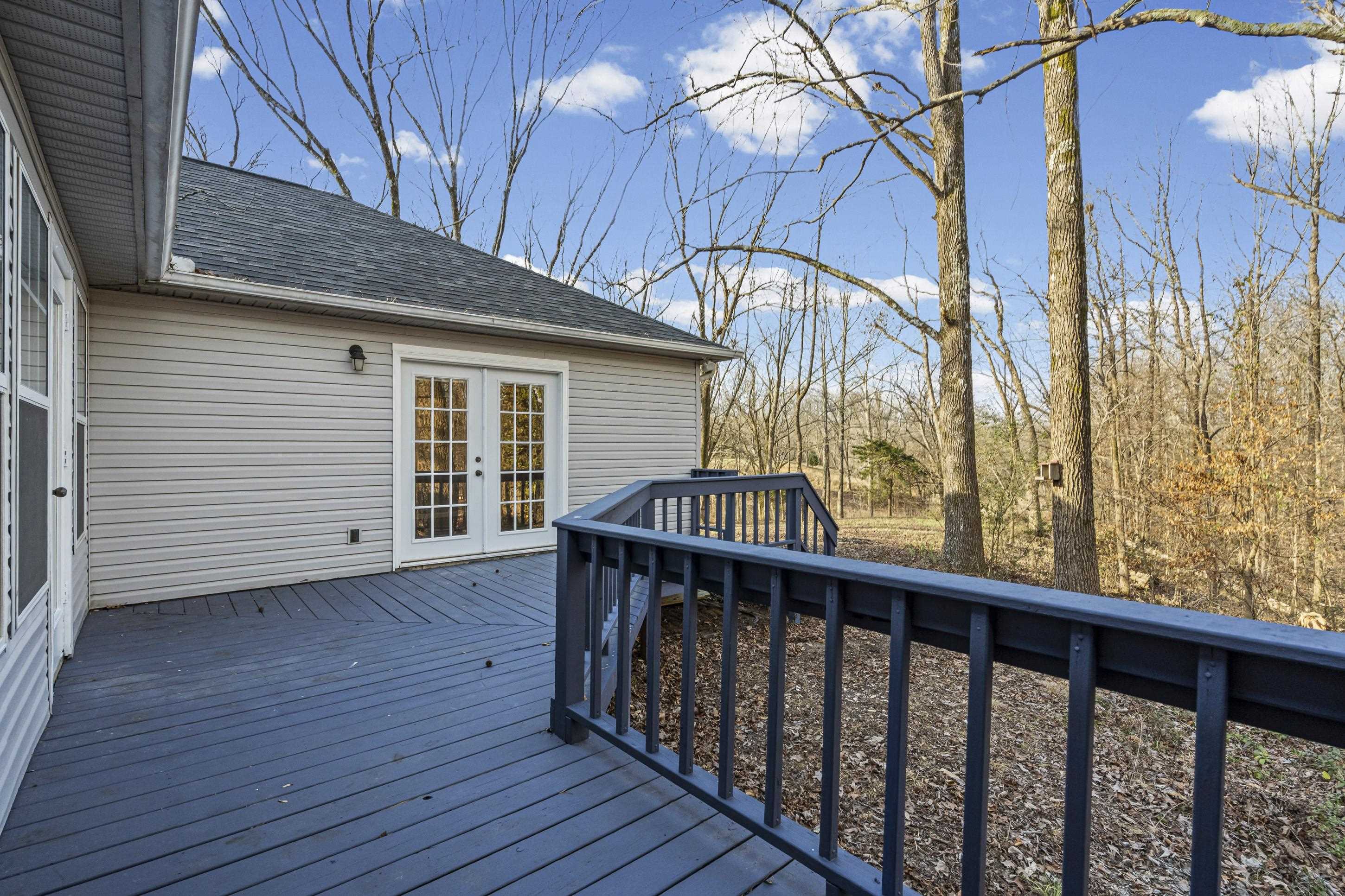225 Poplar Grove Church Road Drummonds, TN 38023 - Photo 20 of 30 a view of a wooden house with a large window