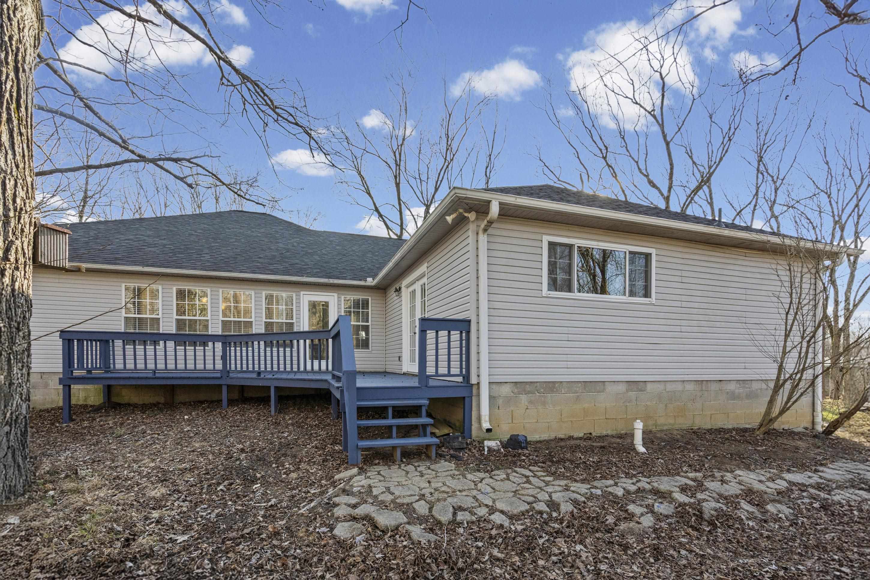 225 Poplar Grove Church Road Drummonds, TN 38023 - Photo 22 of 30 a backyard of a house with barbeque oven and outdoor seating