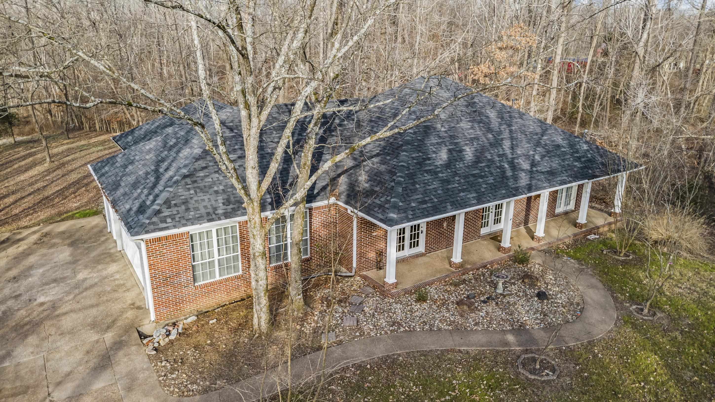 225 Poplar Grove Church Road Drummonds, TN 38023 - Photo 26 of 30 front view of a house with a yard