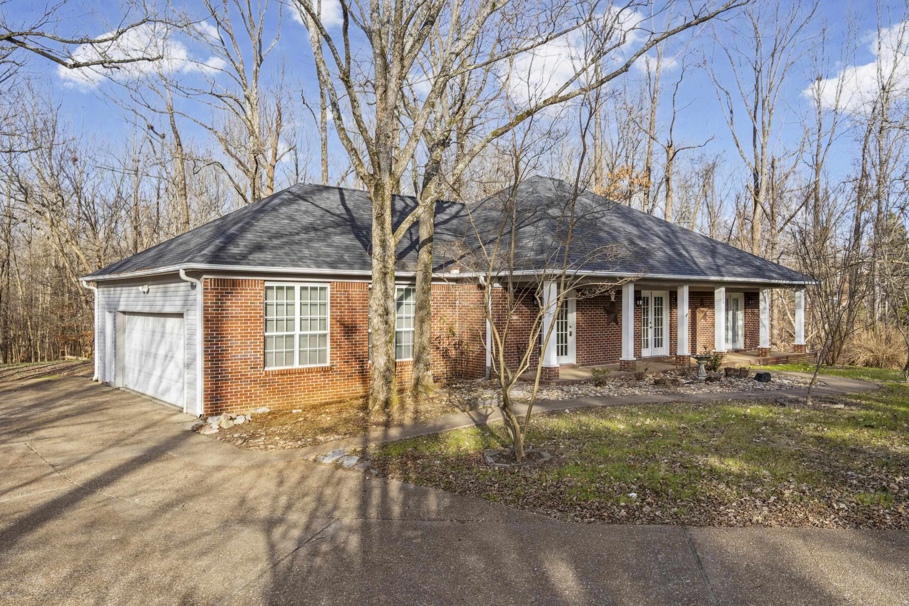 225 Poplar Grove Church Road Drummonds, TN 38023 - Photo 29 of 30 a front view of a house with garden