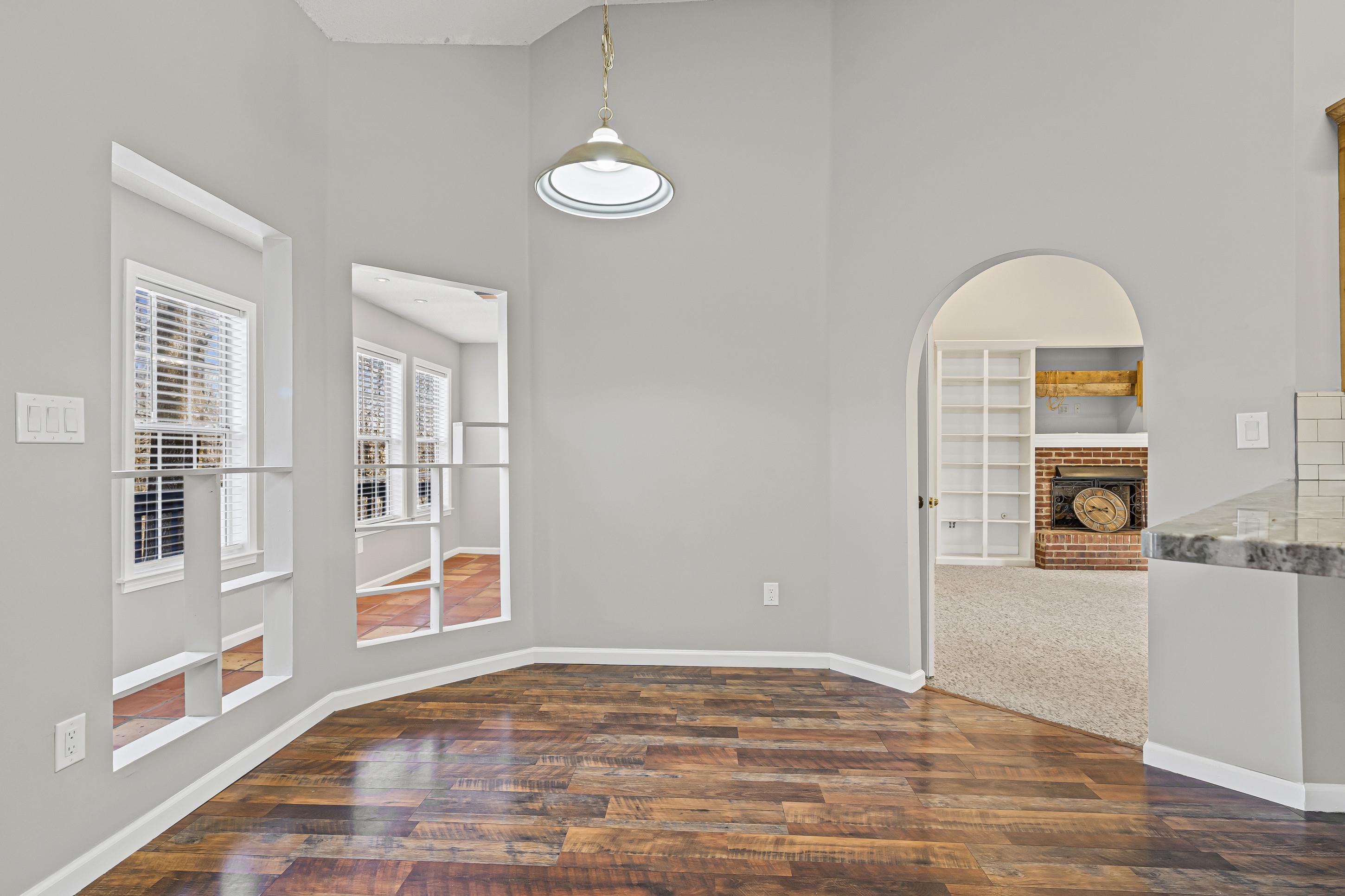 225 Poplar Grove Church Road Drummonds, TN 38023 - Photo 10 of 30 a view of a livingroom with wooden floor and a window