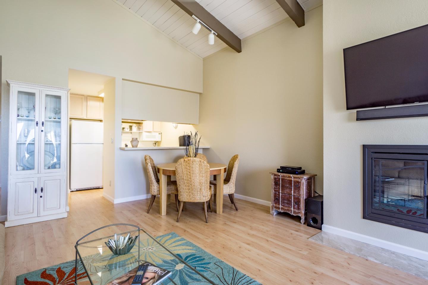 1 Surf Way, Unit 228 Monterey, CA 93940 - Photo 4 of 13 a dining room with furniture and wooden floor