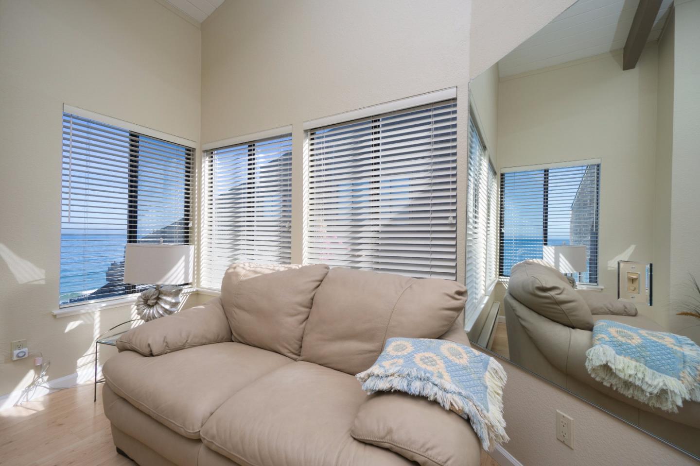 1 Surf Way, Unit 228 Monterey, CA 93940 - Photo 5 of 13 a living room with furniture and a large window