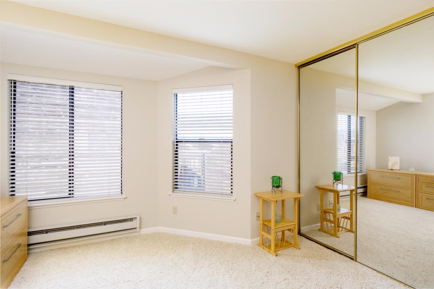 1 Surf Way, Unit 228 Monterey, CA 93940 - Photo 8 of 13 a view of an empty room with a window