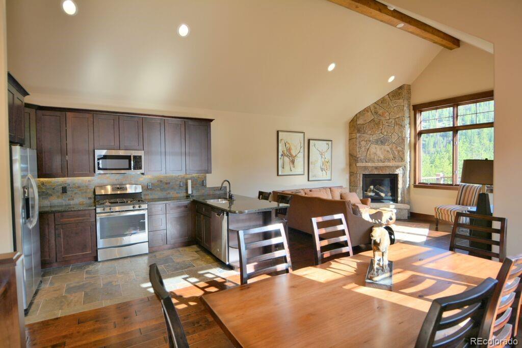 705 Independence Road, Unit 12A Keystone, CO 80435 - Photo 8 of 25 a living room with furniture a large window and kitchen view