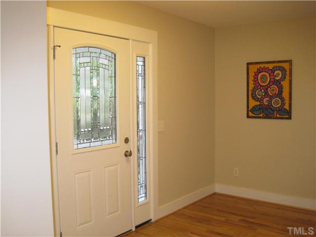 407 Glascock Street Raleigh, NC 27604 - Photo 11 of 25 Large foyer with hardwood floors and beautiful entry door. Foyer