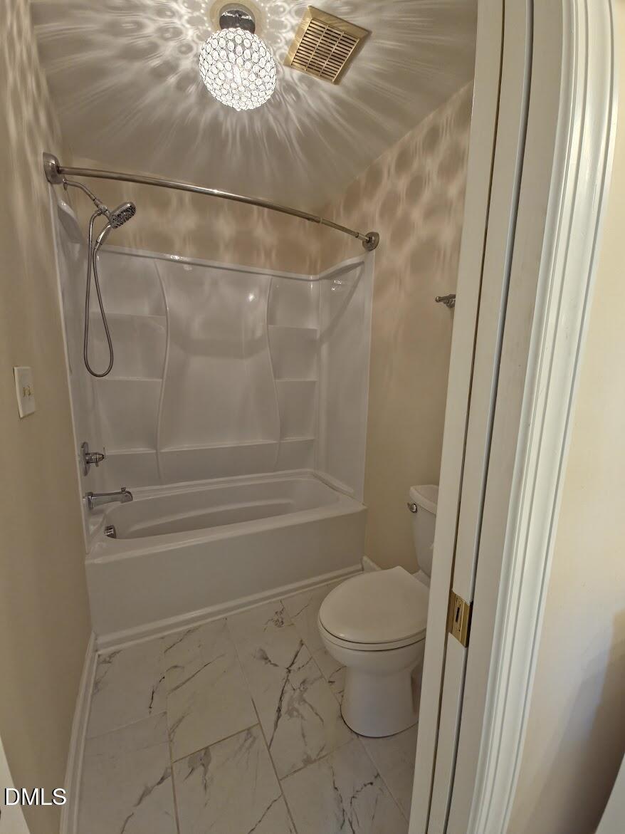 6844 Gloucester Road Raleigh, NC 27612 - Photo 11 of 25 a bathroom with a granite countertop shower and a toilet