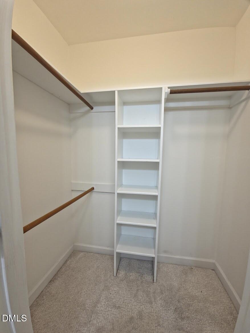 6844 Gloucester Road Raleigh, NC 27612 - Photo 17 of 25 a view of an empty walk in closet
