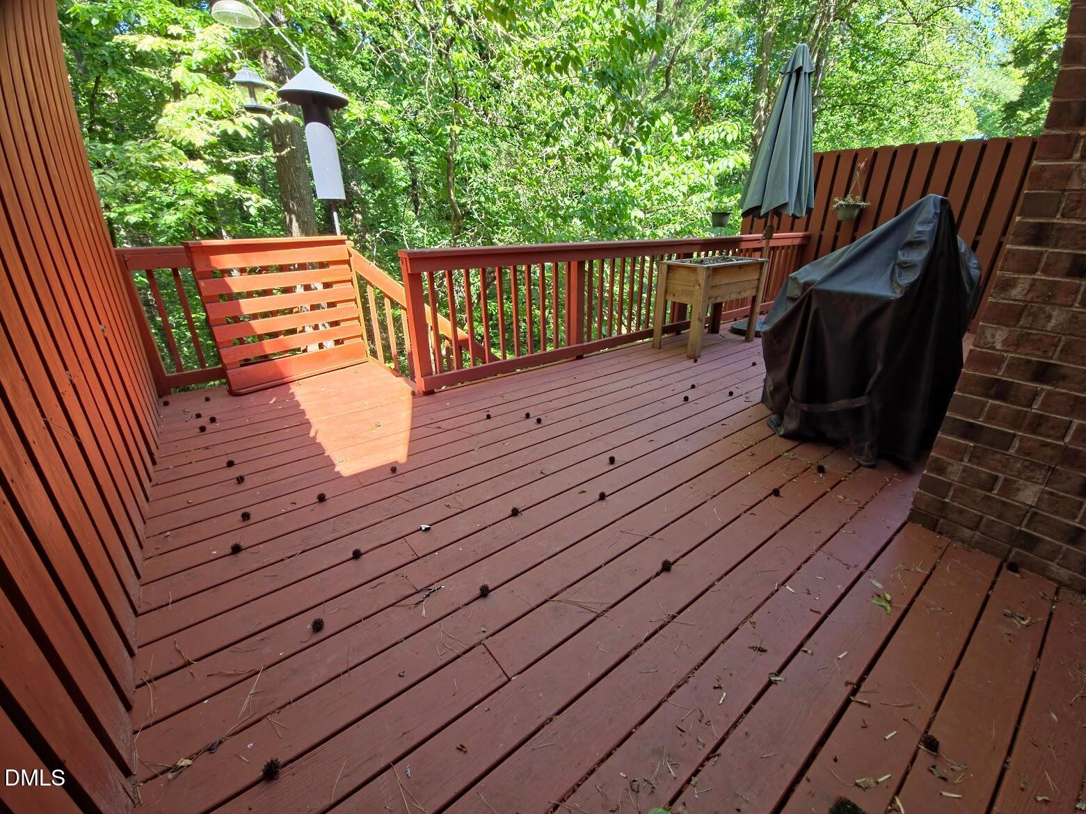 6844 Gloucester Road Raleigh, NC 27612 - Photo 20 of 25 a view of deck with wooden floor and outdoor seating