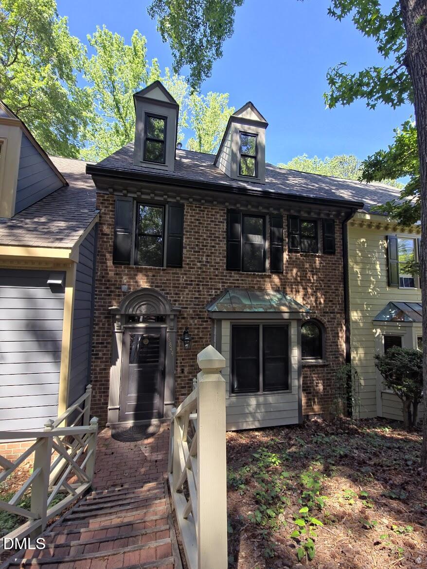 6844 Gloucester Road Raleigh, NC 27612 - Photo 23 of 25 a front view of a house with garden
