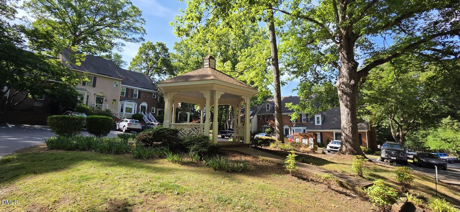 6844 Gloucester Road Raleigh, NC 27612 - Photo 24 of 25 a view of a house with backyard porch and sitting area