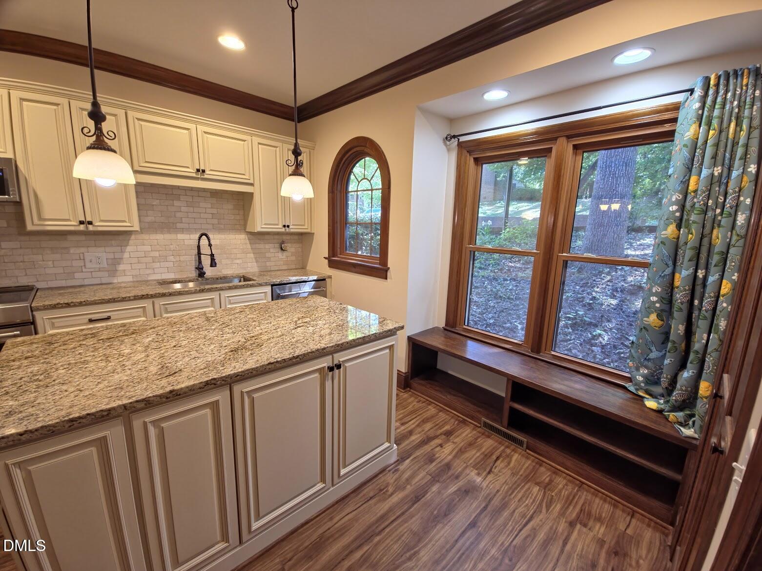 6844 Gloucester Road Raleigh, NC 27612 - Photo 3 of 25 a bathroom with a granite countertop sink and a large mirror