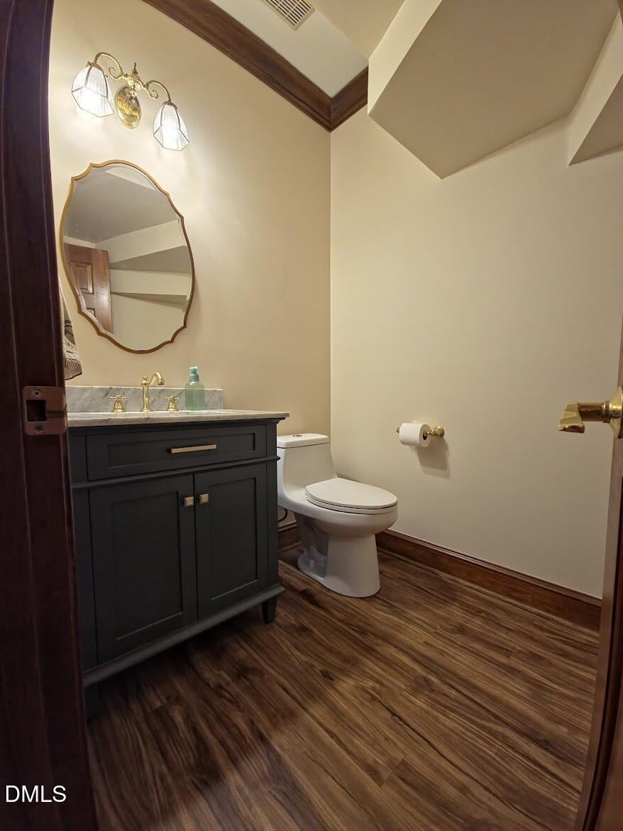 6844 Gloucester Road Raleigh, NC 27612 - Photo 5 of 25 a bathroom with a sink and a mirror