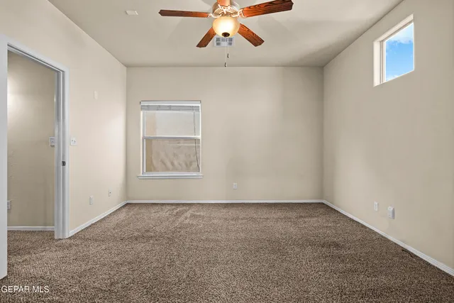 a bathroom with a tub a sink and a mirror