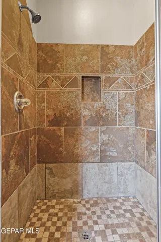 a view of a backyard with wooden fence