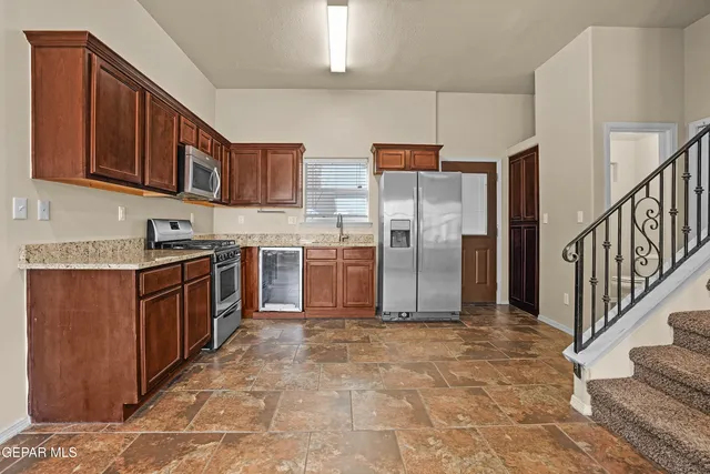 a bathroom with a sink toilet and a mirror