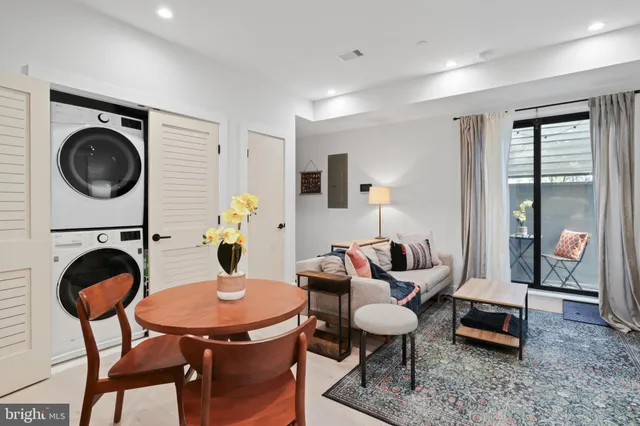 a kitchen with kitchen island a sink stainless steel appliances and cabinets