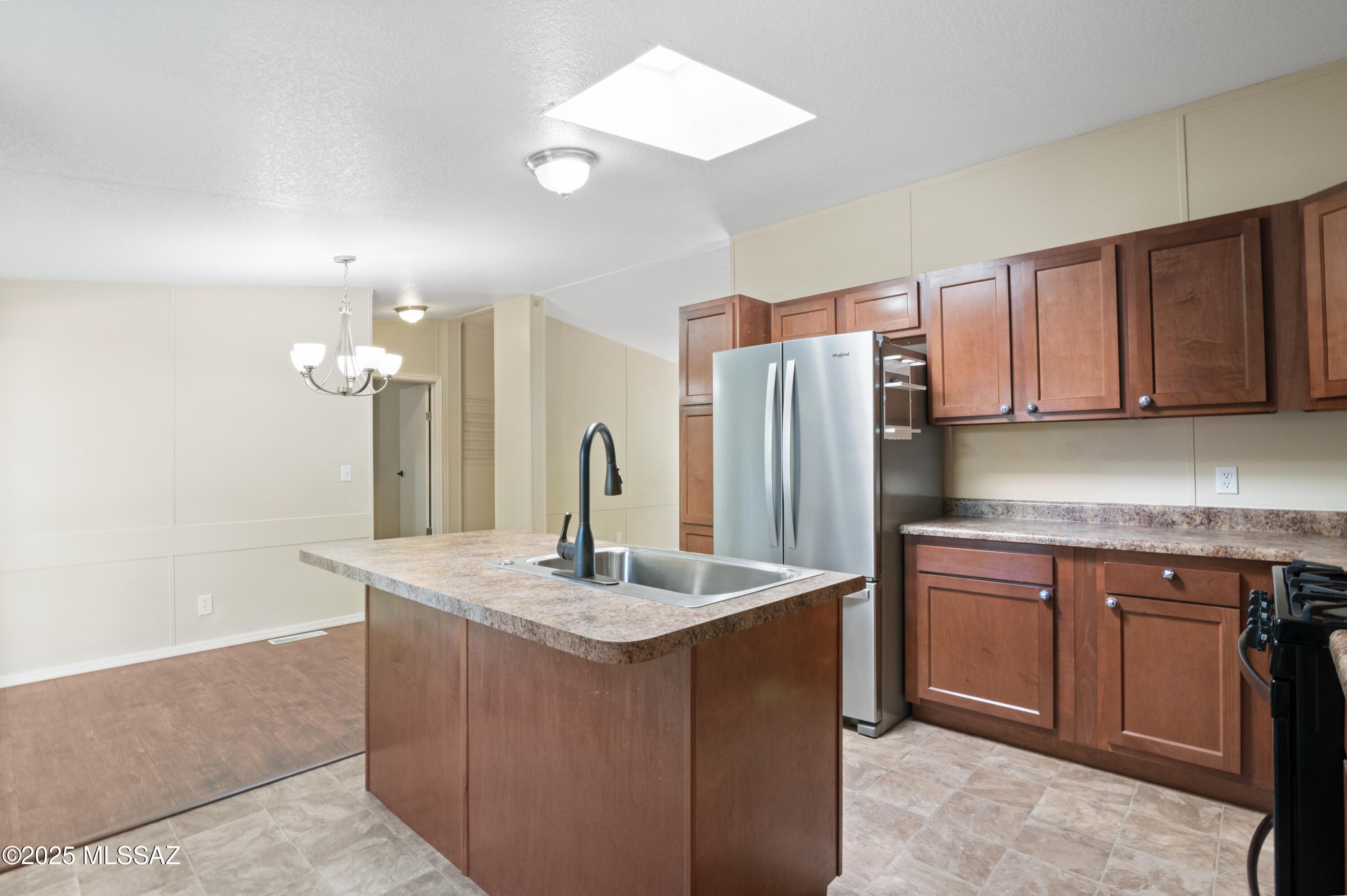 6205 East Rough Rock Drive Tucson, AZ 85756 - Photo 2 of 30 a kitchen with stainless steel appliances granite countertop a sink a refrigerator and a stove