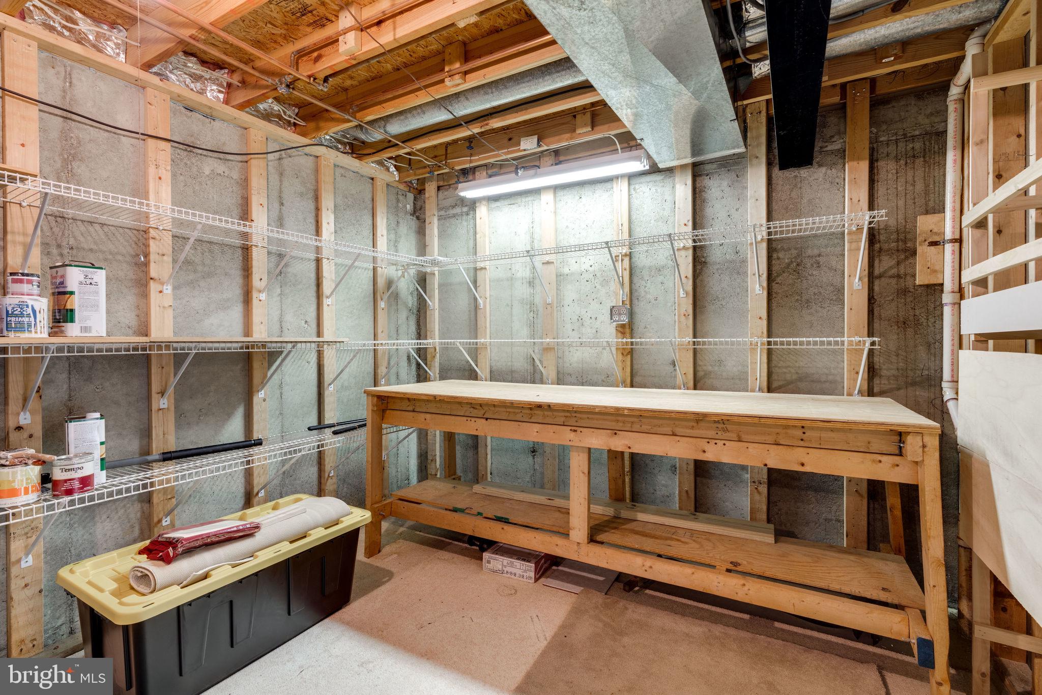 7548 Aspenpark Road Lorton, VA 22079 - Photo 17 of 20 Extensive storage shelves & work bench for DIYers