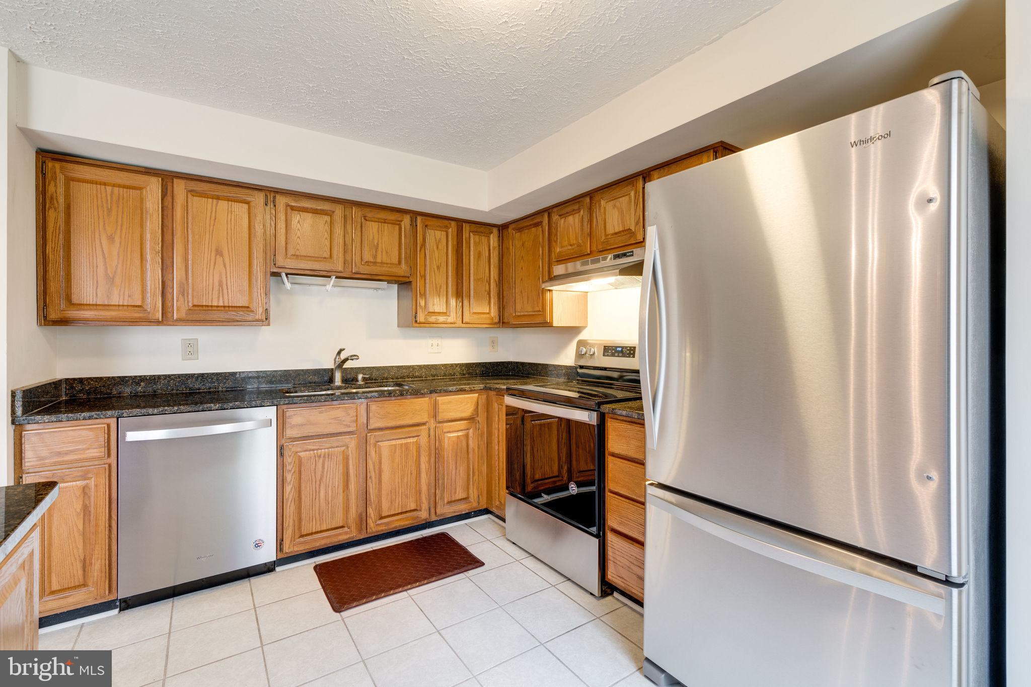 7548 Aspenpark Road Lorton, VA 22079 - Photo 4 of 20 Spaces Kitchen, Counter spaces & ample cabinets