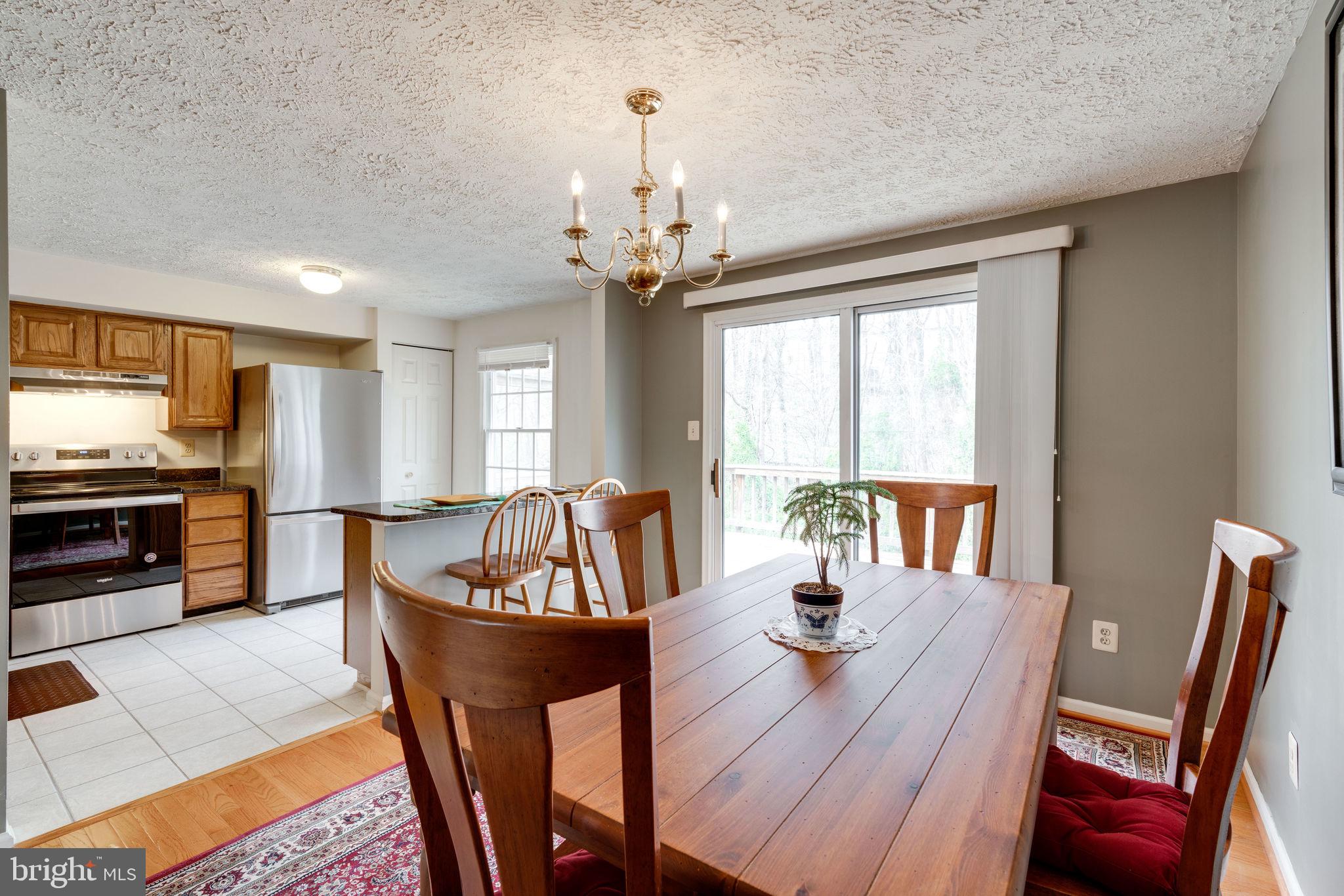 7548 Aspenpark Road Lorton, VA 22079 - Photo 5 of 20 Dining Room with tree view of the deck