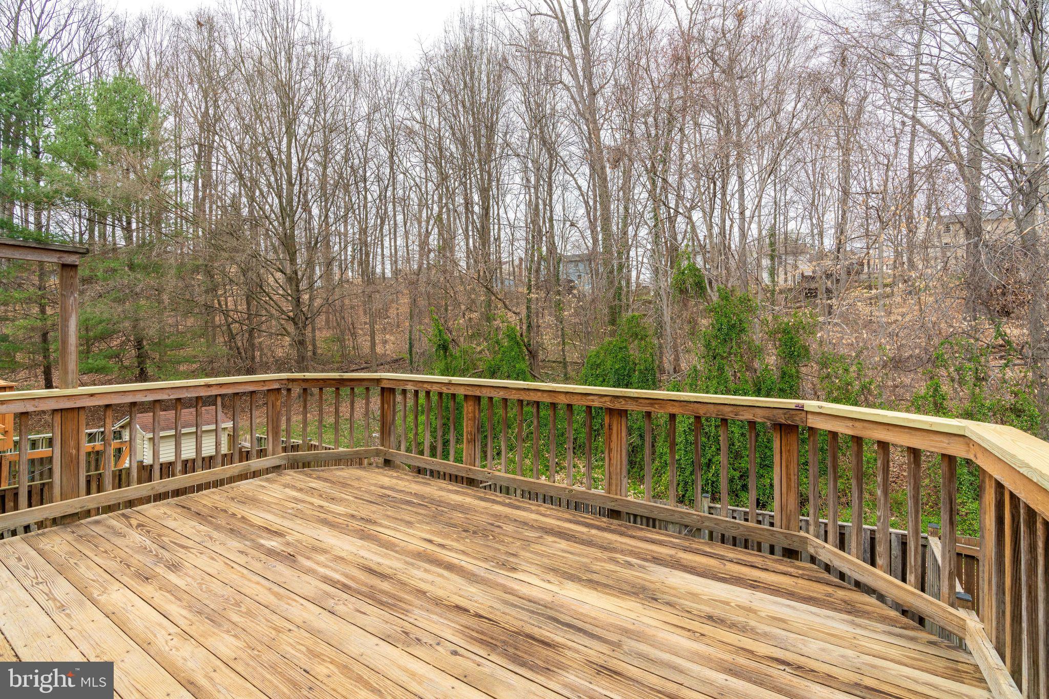 7548 Aspenpark Road Lorton, VA 22079 - Photo 6 of 20 Clean deck on main level, backs to Tree view