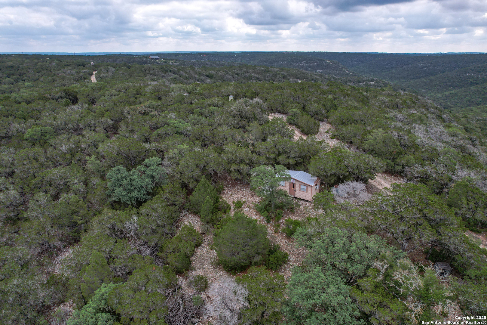824 South Pinon Loop Camp Wood, TX 78833 - Photo 11 of 39 an aerial view of residential houses with outdoor space and trees