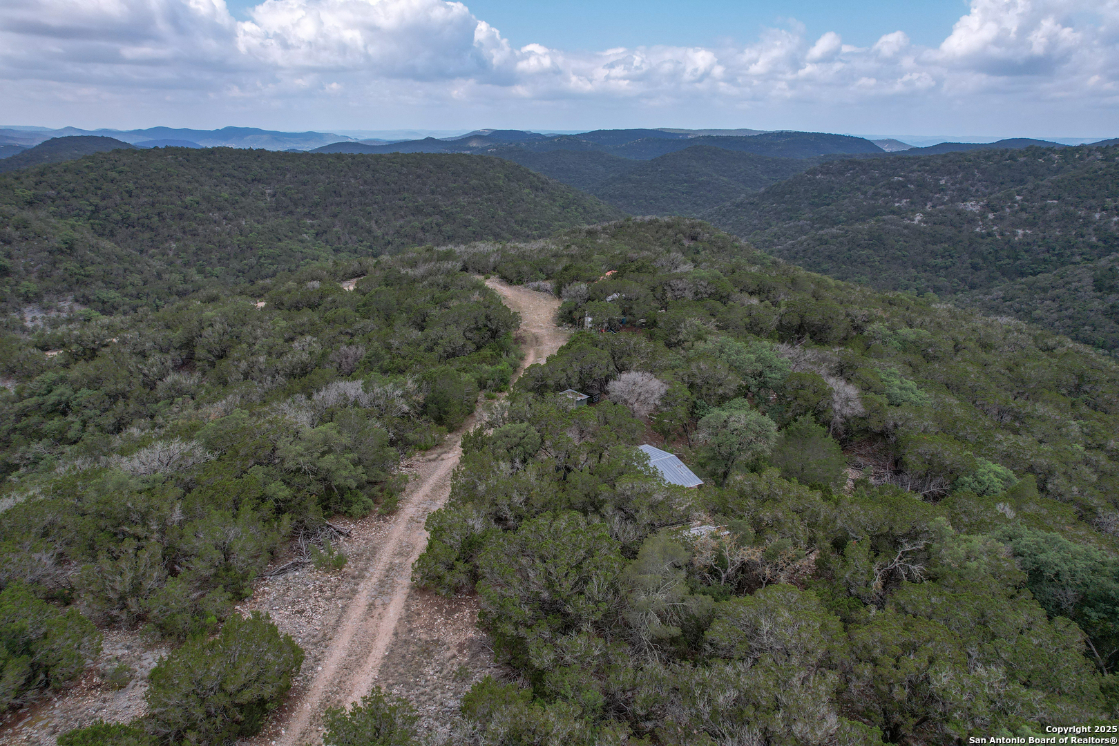 824 South Pinon Loop Camp Wood, TX 78833 - Photo 15 of 39 a view of a lush green hillside and a houses