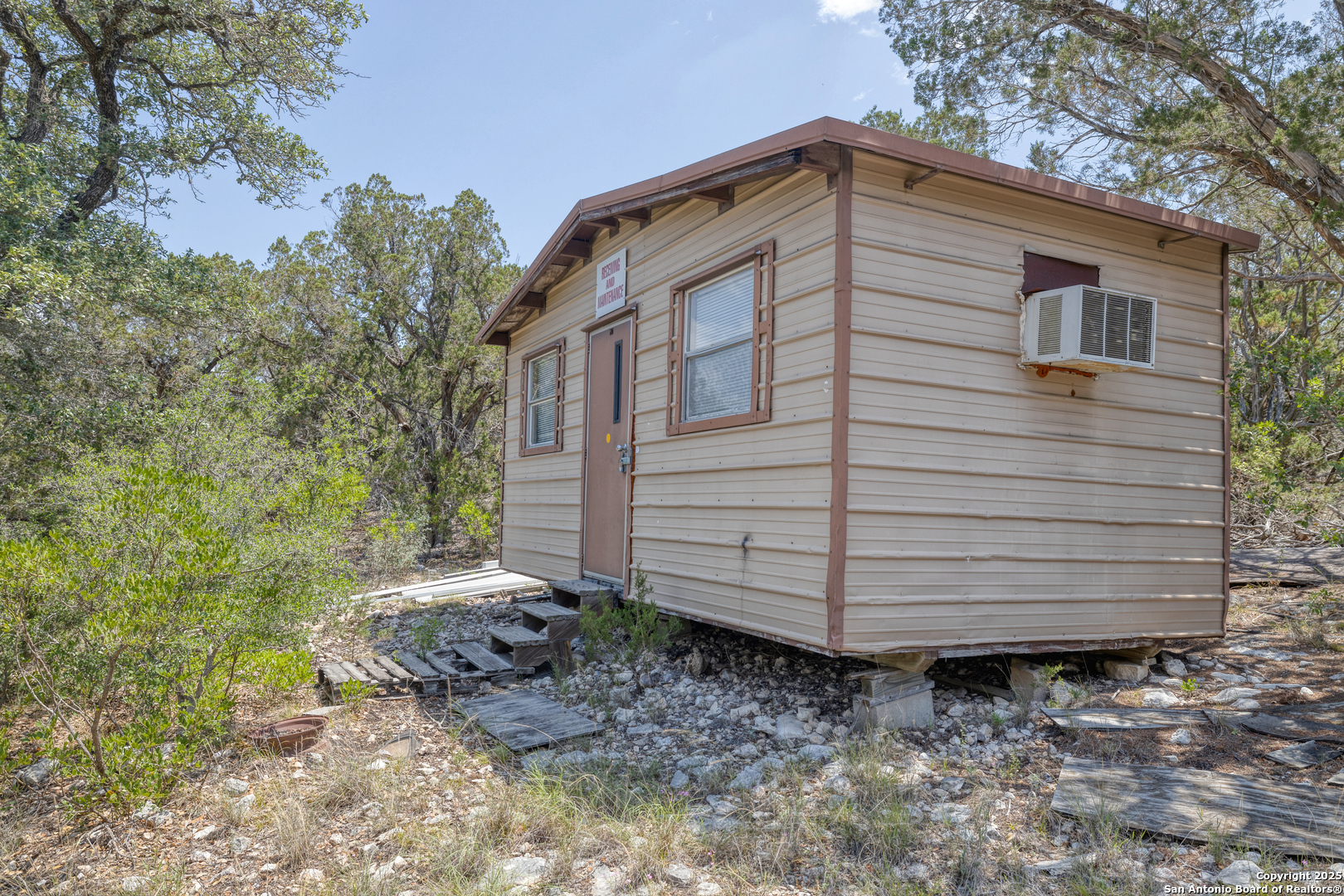 824 South Pinon Loop Camp Wood, TX 78833 - Photo 23 of 39 a front view of a house with a yard