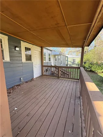 a view of backyard with deck