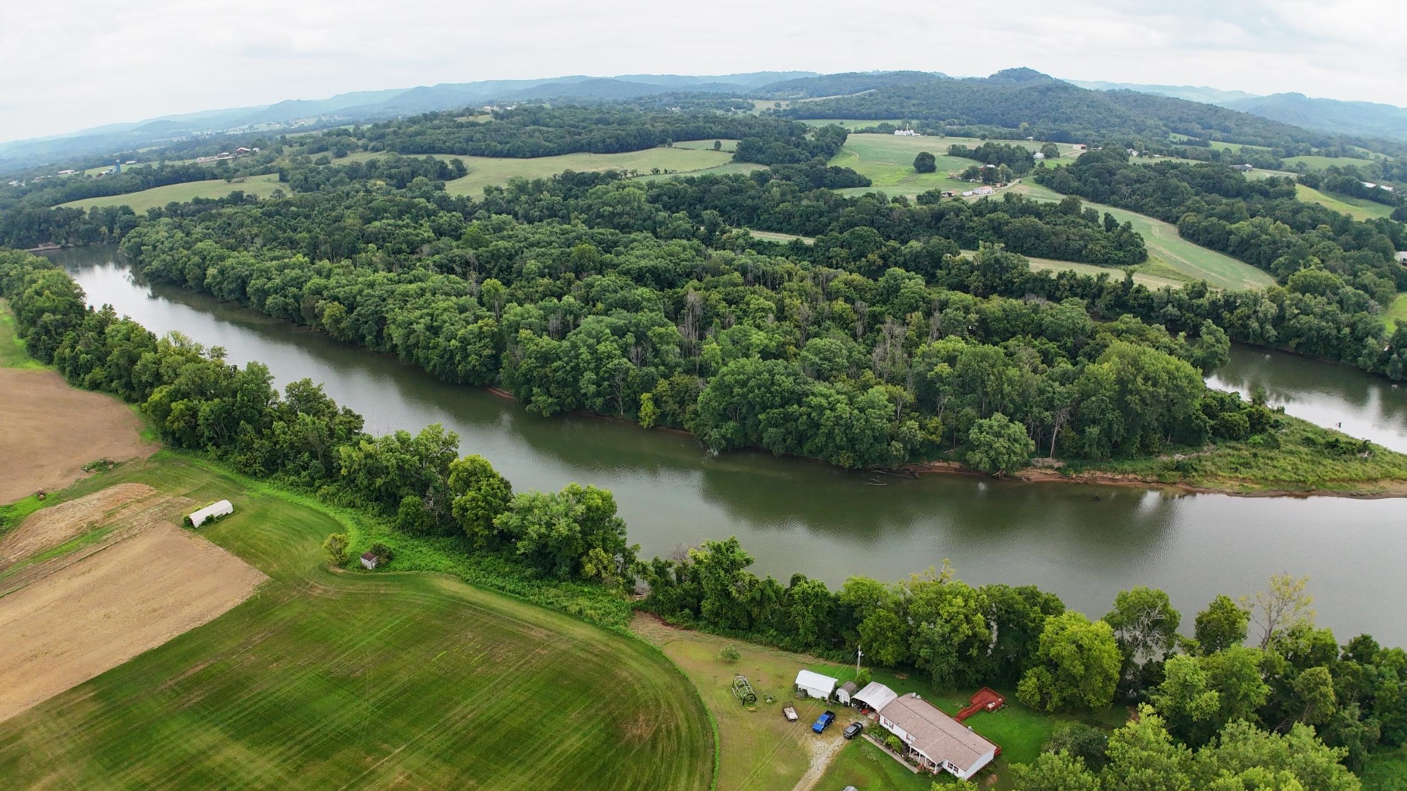 0 Lovells Island Riddleton, TN 37151 - Photo 15 of 15 an aerial view of green landscape with trees houses and lake view
