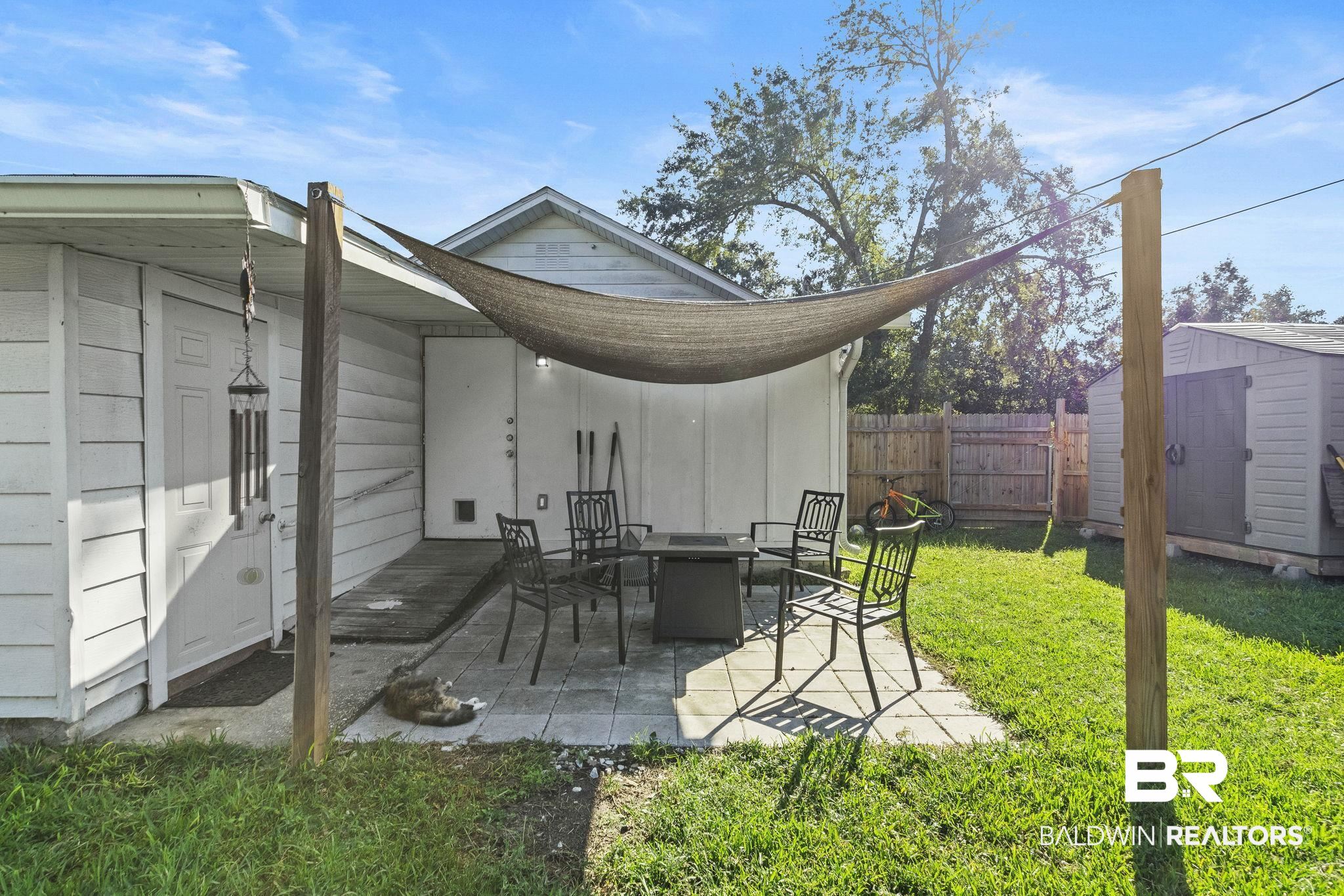 707 North Cedar Street Foley, AL 36535 - Photo 45 of 69 View of patio / terrace featuring a storage shed
