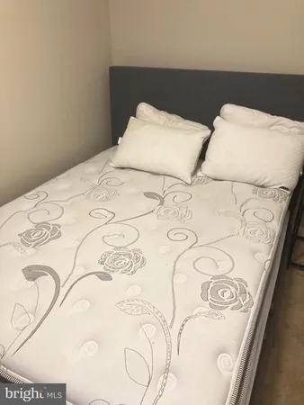 a view of a bedroom with a balcony