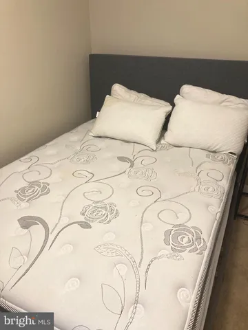 a view of a bedroom with a balcony