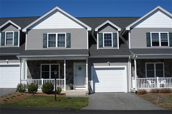 159 Allen Road, Unit 4 Billerica, MA 01821 - Photo 4 of 8 a front view of a house with a yard