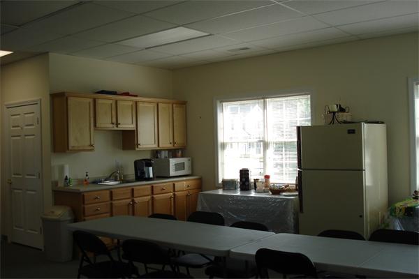 159 Allen Road, Unit 4 Billerica, MA 01821 - Photo 7 of 8 a kitchen with a refrigerator and a sink