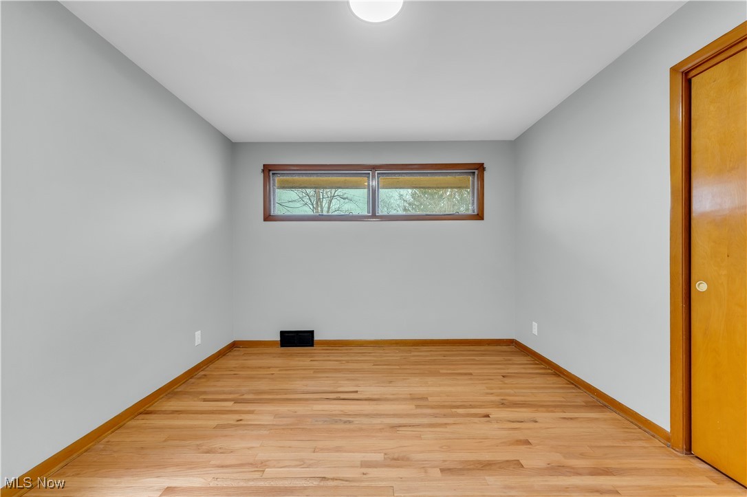 19720 Upper Terrace Road Euclid, OH 44117 - Photo 15 of 31 Unfurnished room featuring light hardwood / wood-style floors