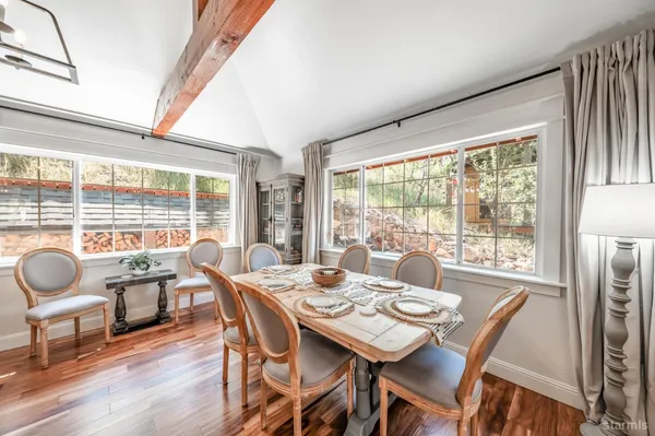 a view of a dining room with furniture window and outside view