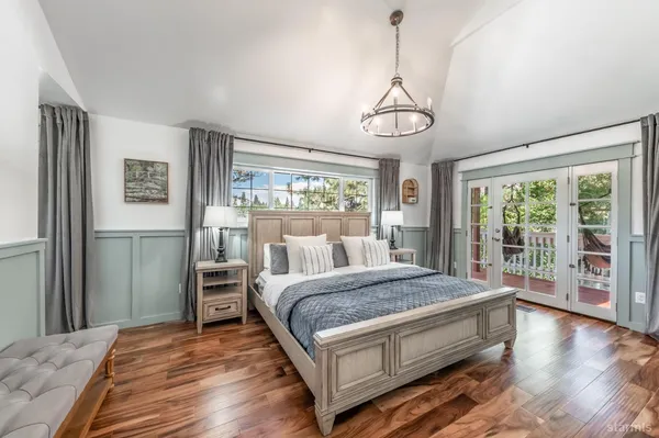 a bedroom with a large bed and a window