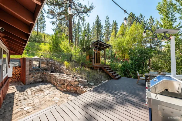 a view of a backyard with sitting area