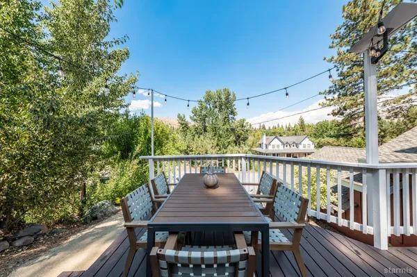 a view of a balcony with two chairs and a table