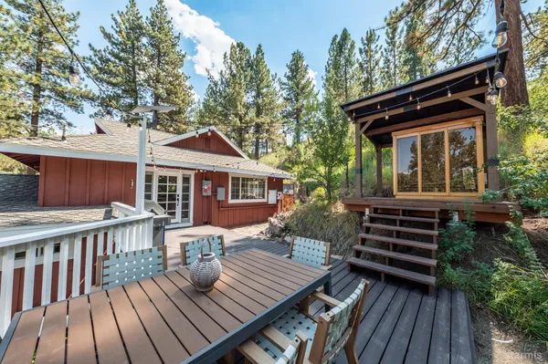 a view of a wooden deck with furniture