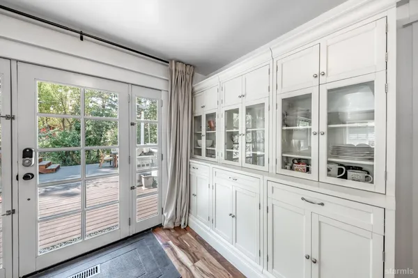 a view of a entrance and room with furniture